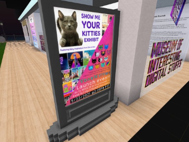 Digital billboard for the Show Me Your Kitties Exhibit outside the Museum of Interesting Digital Stuffs in a virtual world